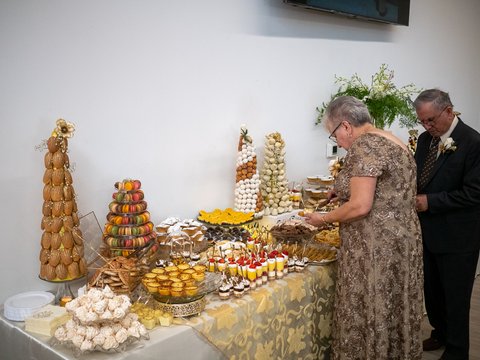 The Cardosos opening the large dessert table