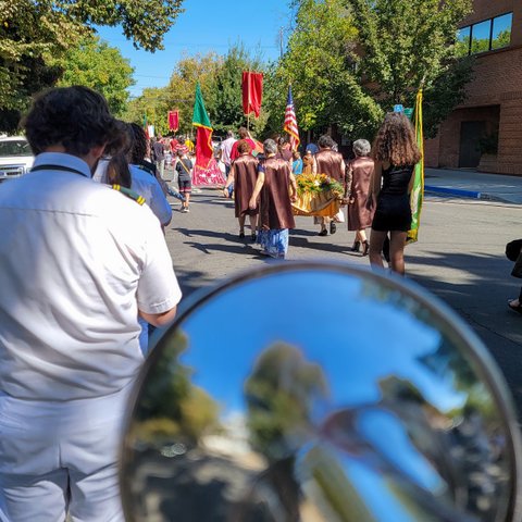 Playing trumpet in a procession